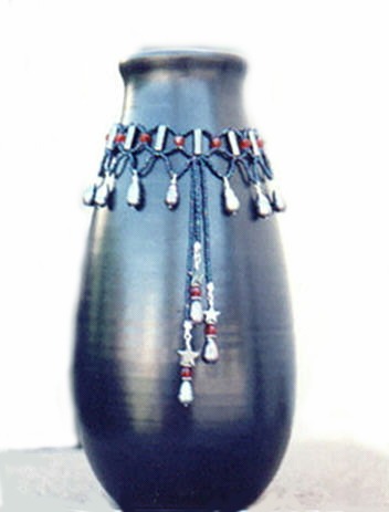 tall handmade matte black ceramic vase with beaded collar pearls and garnet