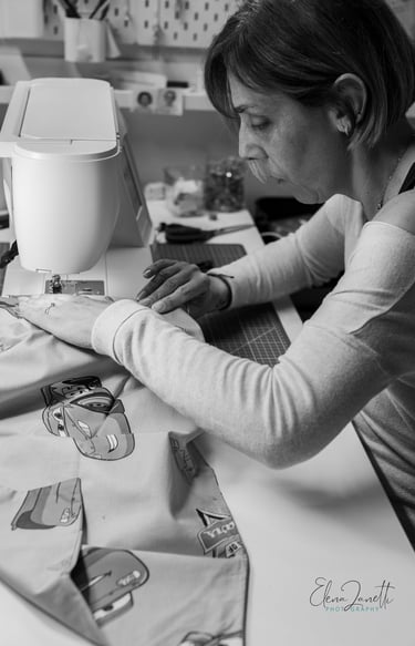 a woman is sewing an accessory on a sewing machine