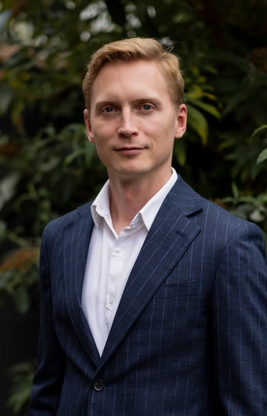 Photo of Misha Verkerk ENT Consultant in a blue suit