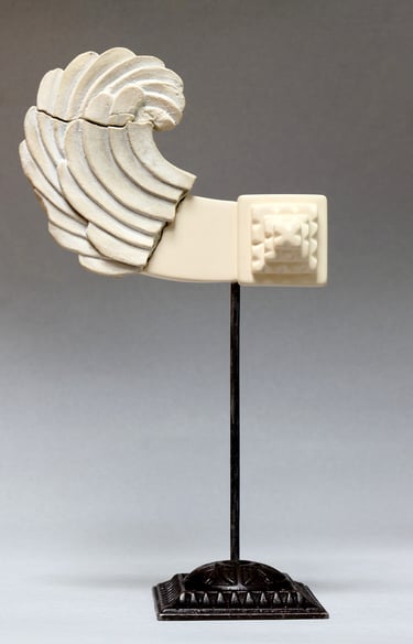 Very small ceramic sculpture variation of fragmented, reconstructed Greek Archaic-style wing.
