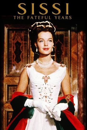 Romy Schneider as Empress Elisabeth in a white gown for the Sissi: The Fateful Years film poster.