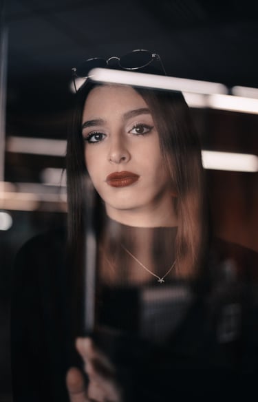 a woman with a black top and sunglasses on
