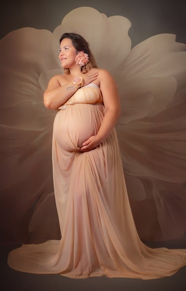a pregnant woman in a dress with a flower in her belly