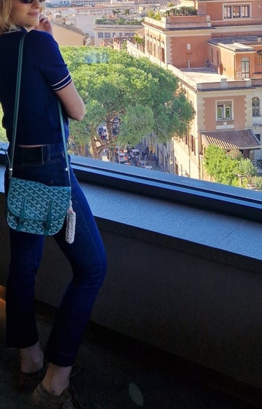 Mary Tornariti enjoying a panoramic city view, Rome.