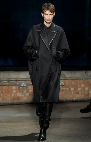 Aaron Esh black oversized coat look on runway at London Fashion Week 2026.