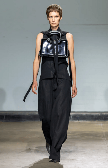 Johanna Parv sleeveless black top with statement bag at London Fashion Week 2026.