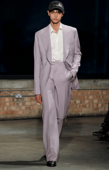 Aaron Esh lilac tailored suit with cap on runway at London Fashion Week 2026.
