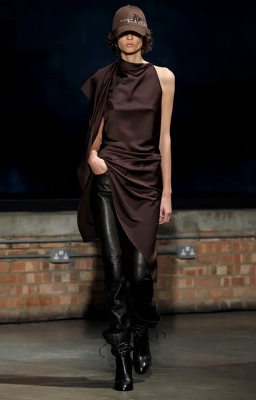 Aaron Esh brown draped dress with leather trousers at London Fashion Week 2026