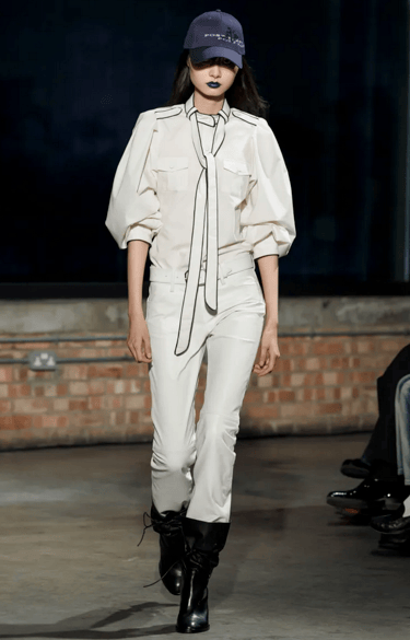 Aaron Esh white blouse and slim trousers look at London Fashion Week 2026.