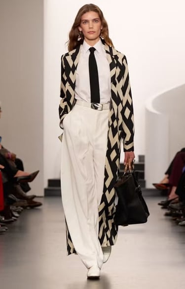 Ralph Lauren Spring Summer 2026 runway model in cream belted safari-inspired outfit.