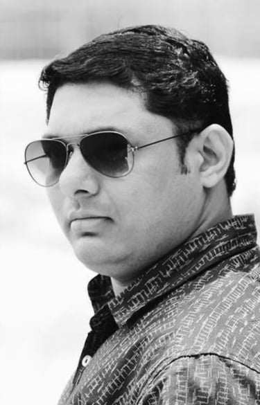 a man with sunglasses is the Founder and CEO of Garuda Digital Arts Photography
