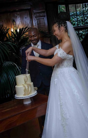 newly-weds cutting their cake