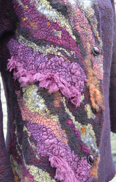Close-up of a purple nuno felted jacket featuring intricate textures and artistic fiber art details.
