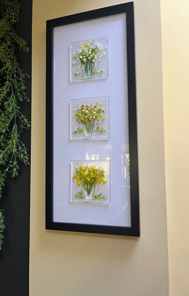 a picture of a picture of fused glass flowers