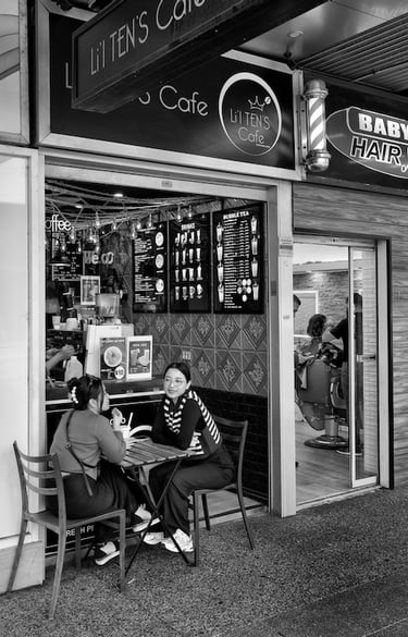 Peter Pickering' captures two girls having coffee outside a Perth cafe