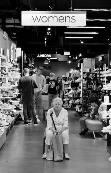 Peter Pickering sees an old lady waiting patiently inside a sports-shoe store