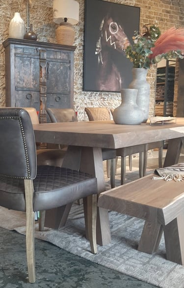 a dining room with a table and chairs