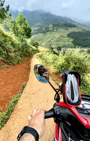 a person riding a motorcycle on a dirt road