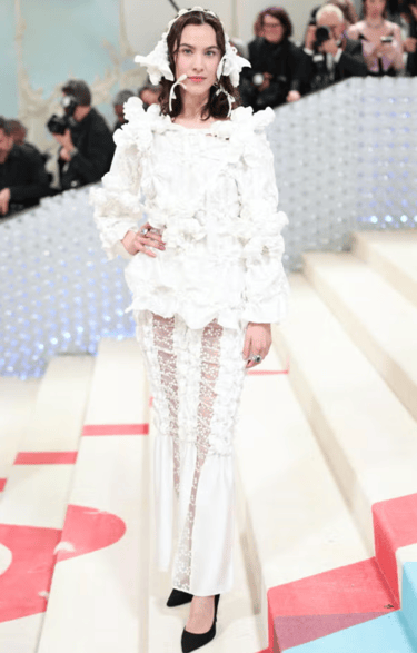 Alexa Chung in handcrafted white floral couture at Met Gala.
