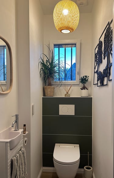 a bathroom with a toilet and a window