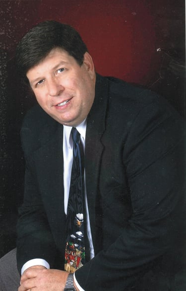 a man in a suit and tie with a tie