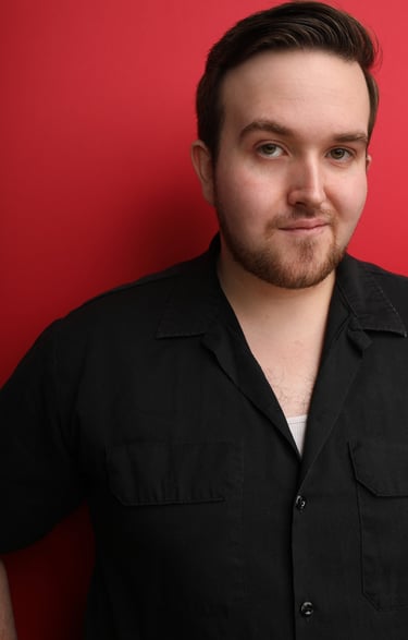 Cade MacFee actor headshot on a red background