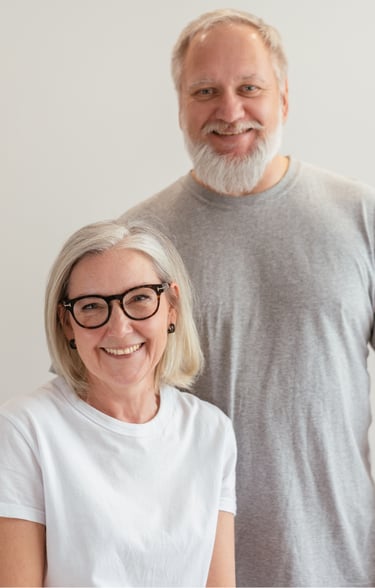 a smiling, middle-aged caucasian couple