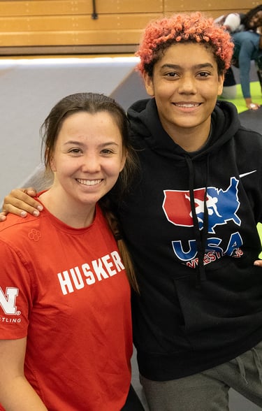 Female wrestlers smiling
