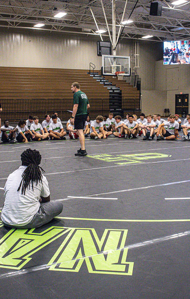Wrestlers hearing from Coach Tre