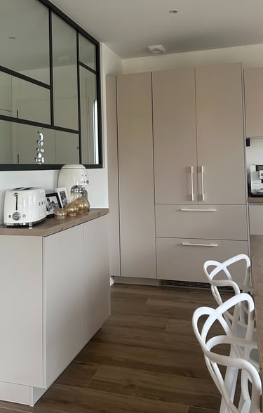 a kitchen with a table and chairs and a counter