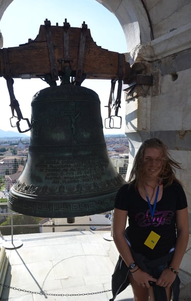 Kyrstin at bell atop Leaning Tower of Pisa