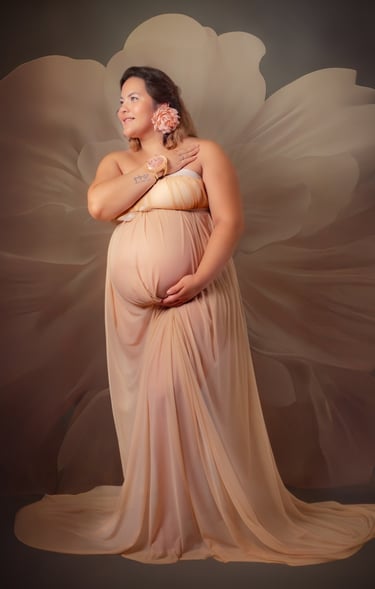 a pregnant woman in a dress with a flower in her belly