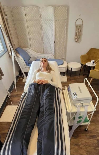 Woman enjoy compression lymphatic massage treatment
