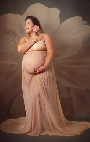 a pregnant woman in a dress with a flower in her belly