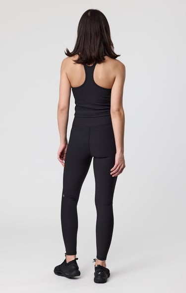 Fashion e-commerce photography - a woman in a black top and leggings