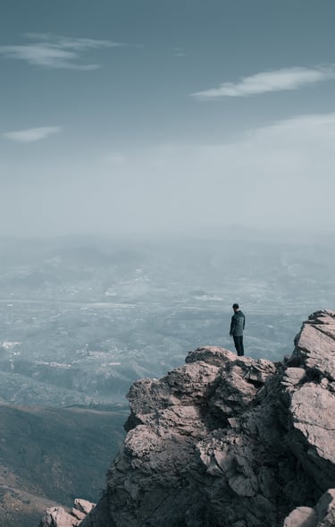 a person standing on a mountain top