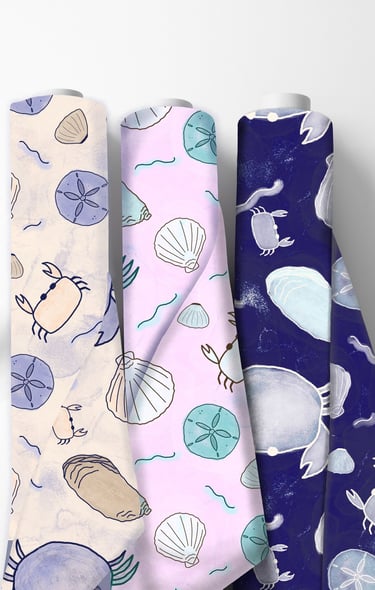 fabric rolls with seashells and crabs on them