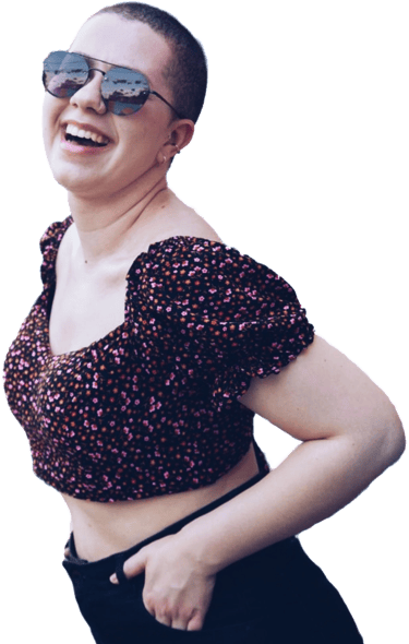 a woman in a cropped top and sunglasses