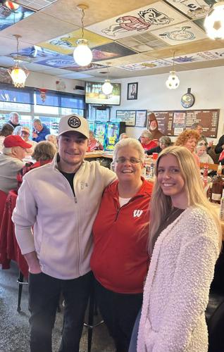 Buck's On Main new owners with previous owner.