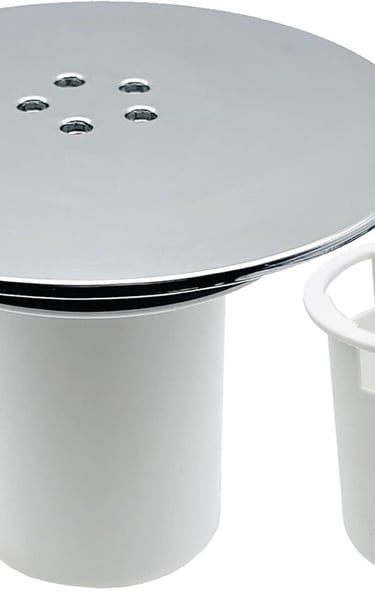 a white toilet with a white sink and a white trash canister