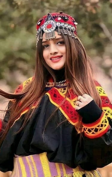 a woman in a colorful dress and a colorful hat