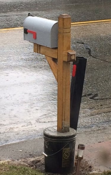 Temporary mailbox with wooden post