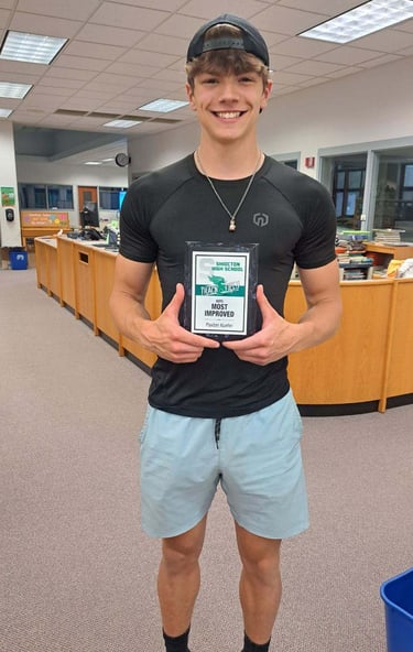 Mobile detailer showing off his most improved award from track.