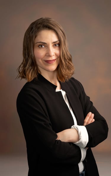 a woman in a black jacket and white shirt
