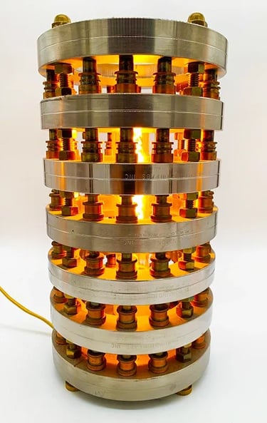 Custom light made from stainless and brass objects.