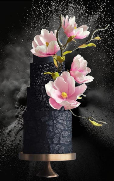 Black wedding cake with pink magnolias 