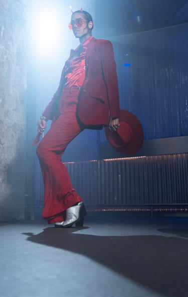 a man in a red suit and a hat