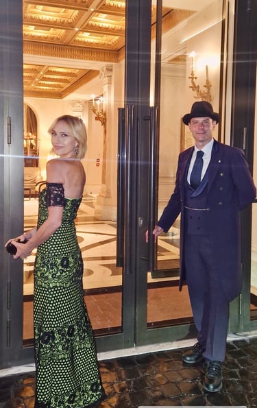 Mary Tornariti at the entrance of Hotel Eden Rome in an evening gown, Rome.