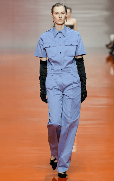 Prada Spring Summer 2026 – Light blue jumpsuit with gloves.