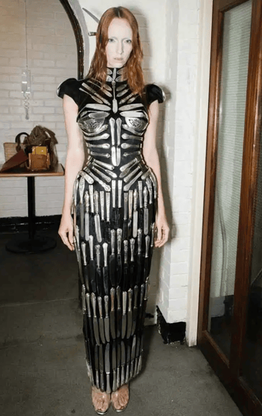 Avant-garde couture gown crafted from antique silver cutlery.